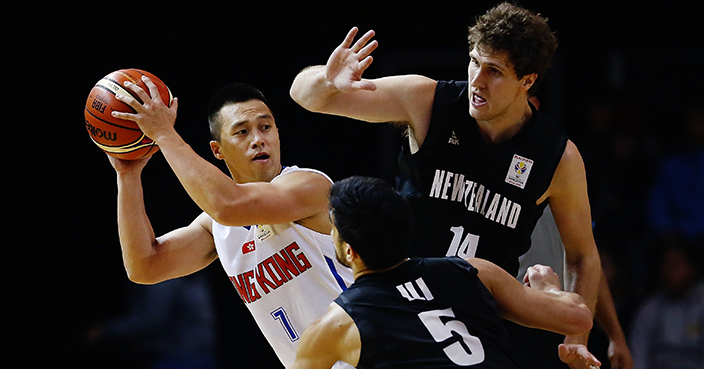 ROTORUA, NEW ZEALAND - JUNE 28:  Lee Ki of Hong Kong competes against Shea Ili and Rob Loe of New Zealand during the FIBA World Cup Qualifying match between the New Zealand Tall Blacks and Hong Kong at Energy Events Centre on June 28, 2018 in Rotorua, New Zealand.  (Photo by Anthony Au-Yeung/Getty Images)
