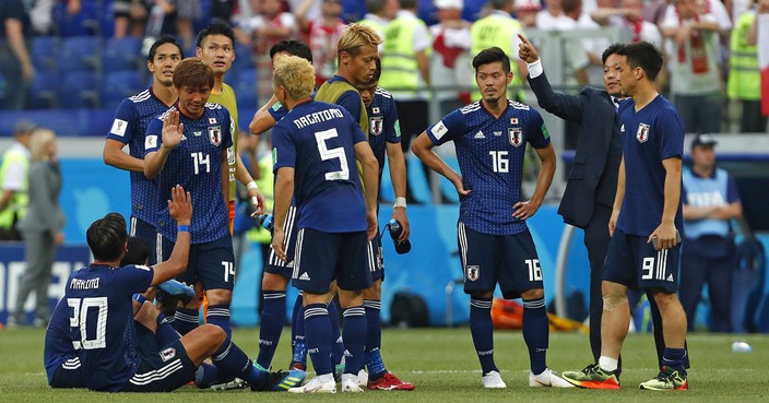 Japanese players gather after the group H match between Japan and Poland at the 2018 soccer World Cup at the Volgograd Arena in Volgograd, Russia, Thursday, June 28, 2018. Japan lost 1-0, but still qualified for the round of 16. (AP Photo/Darko Vojinovic)
