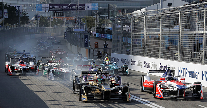 Electric racing cars complete during the first lap at the Formula E Hong Kong ePrix auto race in Hong Kong, Saturday, Dec. 2, 2017. (AP Photo/Kin Cheung)
