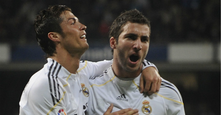 MADRID, SPAIN - MARCH 20:  Gonzalo Higuain (R) of Real Madrid celebrates with Cristiano Ronaldo after scoring Real's third goal during the La Liga match between Real Madrid and Sporting Gijon at Estadio Santiago Bernabeu on March 20, 2010 in Madrid, Spain.  (Photo by Denis Doyle/Getty Images)