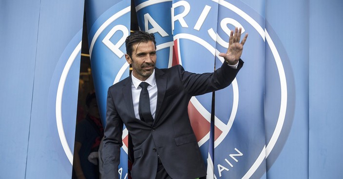 PSG's new signing goalkeeper Gianluigi Buffon poses for photographers during his official presentation at the Parc des Princes stadium in Paris, France, Monday, July 9, 2018. Free agent Gianluigi Buffon signed for Paris Saint-Germain last Friday. The veteran goalkeeper penned a one-year deal at the French champion with the option for an additional season. (AP Photo/Jean-Francois Badias)