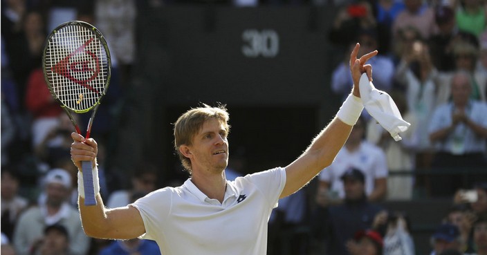 Kevin Anderson of South Africa celebrates winning his men's quarterfinals match against Switzerland's Roger Federer, at the Wimbledon Tennis Championships, in London, Wednesday July 11, 2018. (AP Photo/Ben Curtis)