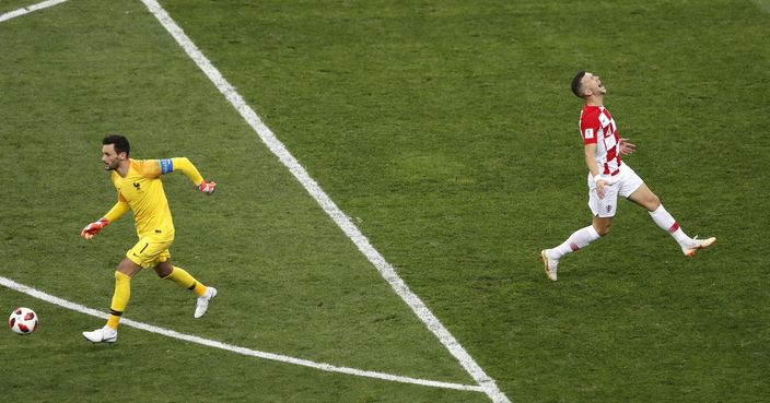 Croatia's Ivan Perisic, right, reacts as France goalkeeper Hugo Lloris controls the ball during the final match between France and Croatia at the 2018 soccer World Cup in the Luzhniki Stadium in Moscow, Russia, Sunday, July 15, 2018. (AP Photo/Frank Augstein)