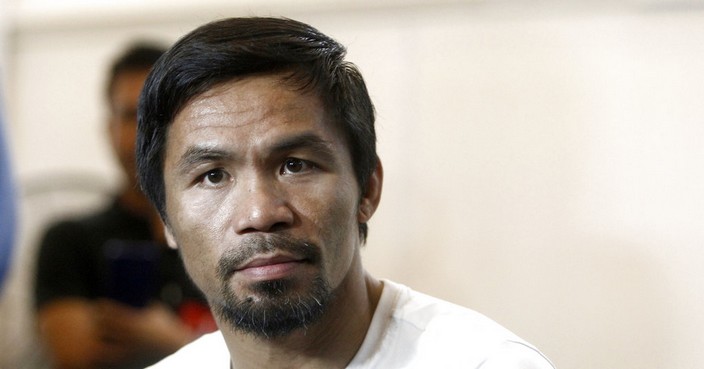 Philippine senator and boxing champion Manny Pacquiao trains at a press preview in Kuala Lumpur, Malaysia, Wednesday, July 11, 2018. Pacquiao is scheduled to fight Lucas Matthysse on July 15, 2018, for the World Boxing Association welterweight title in Malaysia. (AP Photo/Yam G-Jun)