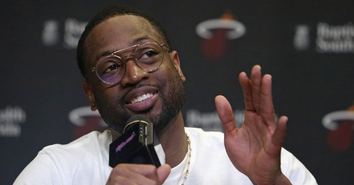 FILE - In this Feb. 9, 2018, file photo, Miami Heat guard Dwyane Wade talks with the media after NBA basketball practice at the AmericanAirlines Arena in Miami. Dwyane Wade has a new contract — with his shoe company. Wade and the Chinese apparel company Li-Ning announced that the three-time NBA champion has signed a lifetime contract with the brand, which he has represented since 2012. The finalizing of that deal coincided with Wade and the company revealing his latest shoe, the 