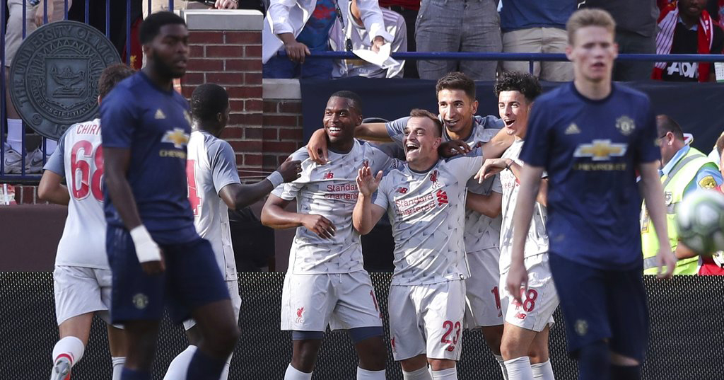 Liverpool midfielder Xherdan Shaqiri (23) celebrates his goal with teammates during the second half of an International Champions Cup tournament soccer match against Manchester United, Saturday, July 28, 2018, in Ann Arbor, Mich. (AP Photo/Carlos Osorio)