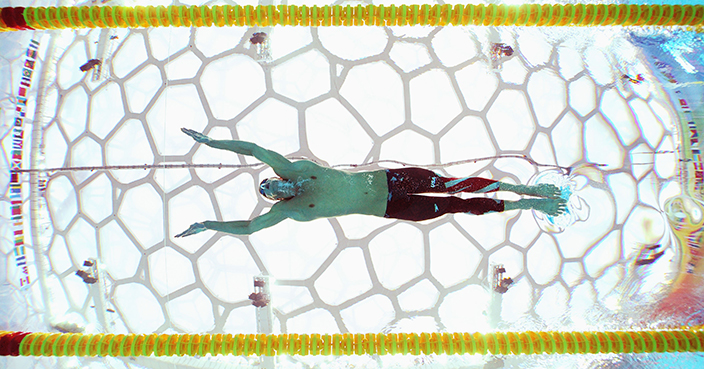 BEIJING - AUGUST 13:  Michael Phelps of the United States competes in the Men's 200m Butterfly Final competes in the swimming event at the National Aquatics Centre during Day 5 of the Beijing 2008 Olympic Games on August 13, 2008 in Beijing, China.  Michael Phelps of the United States finished the race in a time of 1.52.49 a new World Record.  (Photo by Adam Pretty/Getty Images)