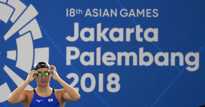 Japan's Rikako Ikee, prepares to start in her women's 100m freestyle heat during swimming competition at the 18th Asian Games in Jakarta, Indonesia, Monday, Aug. 20, 2018.(AP Photo/Bernat Armangue )