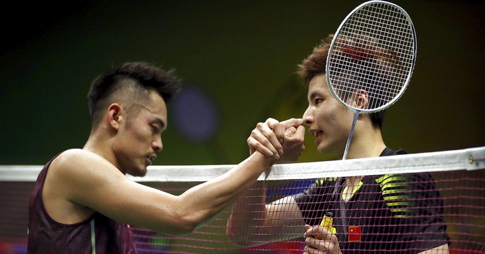 Shi Yuqi of China, right, shakes hands with Lin Dan of China after beating Lin in their men's badminton singles match at the BWF World Championships in Nanjing, China, Thursday, Aug. 2, 2018. (AP Photo/Mark Schiefelbein)