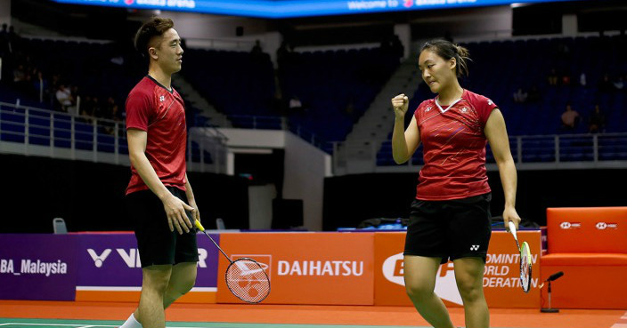 Tse Ying Suet, right, and Tang Chun Man of Hong Kong reacts after getting a point during the quarterfinal round of the mixed doubles match against Chan Peng Soon and Goh Liu Ying of Malaysia in the 2018 Malaysia Masters badminton tournament in Kuala Lumpur, Malaysia, Friday, Jan. 19, 2018. Tse Ying Suet and Tang Chun Man win in 2 sets game with the score 21-13, 21-16 in 39 minutes. (AP Photo/Sadiq Asyraf)
