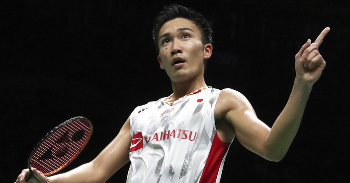 Kento Momota of Japan reacts after beating Shi Yuqi of China in their men's badminton championship match at the BWF World Championships in Nanjing, China, Sunday, Aug. 5, 2018. (AP Photo/Mark Schiefelbein)