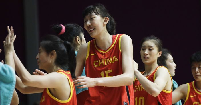 China's womens basketball team shake each others hands after winning their women's basketball match against China at the 18th Asian Games in Jakarta, Indonesia on Friday, Aug. 17, 2018. (AP Photo/Aaron Favila)