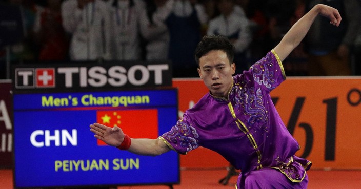 China's Peiyuan Sun perform during the Wushu games at the 18th Asian Games in Jakarta, Indonesia on Sunday, Aug. 19, 2018. Sun won gold. (AP Photo/Aaron Favila)
