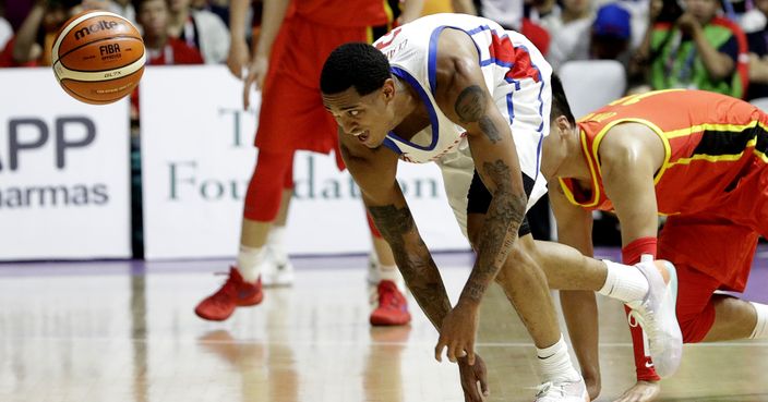 Philippines' Jordan Clarkson chases after the ball during their men's basketball game against China at the 18th Asian Games in Jakarta, Indonesia on Tuesday, Aug. 21, 2018. (AP Photo/Aaron Favila)