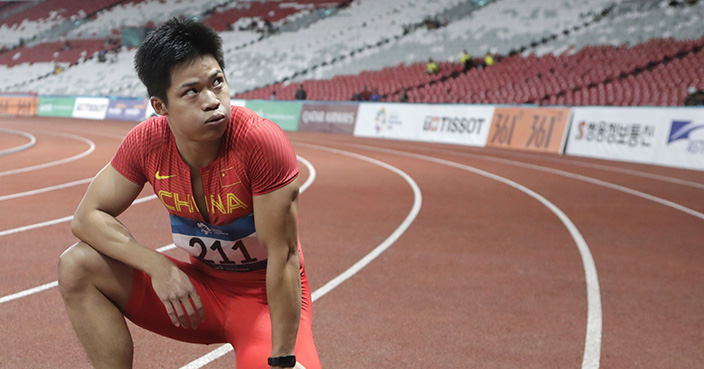 China's Su Bingtian reacts after winning the men's 100m final during the athletics competition at the 18th Asian Games in Jakarta, Indonesia, Sunday, Aug. 26, 2018. (AP Photo/Lee Jin-man)