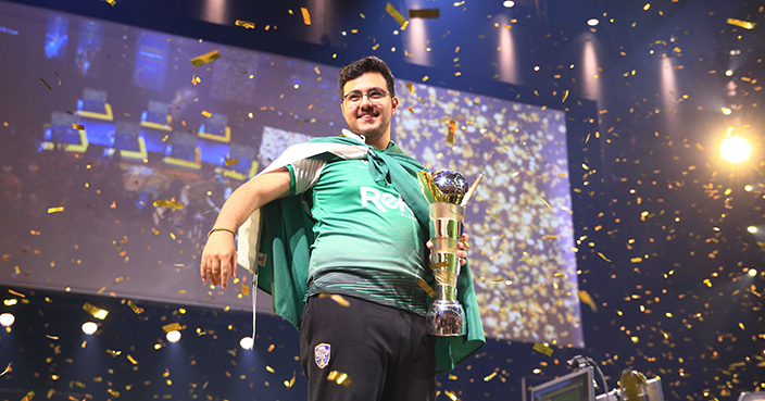 LONDON, ENGLAND - AUGUST 04:  Mosaad 'MSDossary' Aldossary of Saudia celebrates with the trophy after victory in the Grand Final FIFA eWorld Cup 2018 at The O2 Arena on August 4, 2018 in London, England.  (Photo by Ben Hoskins - FIFA/FIFA via Getty Images)
