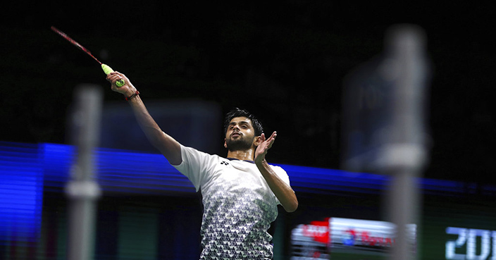 Sai Praneeth B. of India plays a shot as he competes against Kento Momota of Japan in their men's badminton quarterfinal match at the BWF World Championships in Nanjing, China, Friday, Aug. 3, 2018. (AP Photo/Mark Schiefelbein)