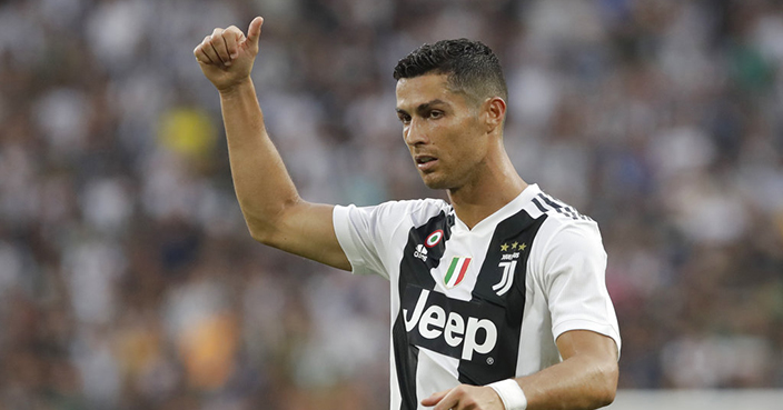 Juventus' Cristiano Ronaldo, gestures to his teammates during the Serie A soccer match between Juventus and Lazio at the Allianz Stadium in Turin, Italy, Saturday, Aug. 25, 2018. (AP Photo/Luca Bruno)