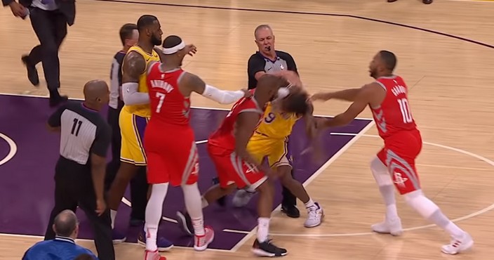 Houston Rockets' Chris Paul, second from left, is held back by Los Angeles Lakers' LeBron James, left, as Paul fights with Lakers' Rajon Rondo, center obscured, during the second half of an NBA basketball game Saturday, Oct. 20, 2018, in Los Angeles. The Rockets won, 124-115. (AP Photo/Marcio Jose Sanchez)