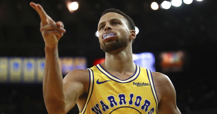 Golden State Warriors' Stephen Curry celebrates a score against the Washington Wizards during the second half of an NBA basketball game, Wednesday, Oct. 24, 2018, in Oakland, Calif. (AP Photo/Ben Margot)