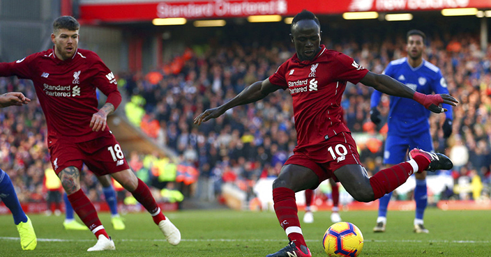 Liverpool's Sadio Mane scores his side's second goal of the game, during the English Premier League soccer match between Liverpool and Cardiff City at Anfield, in Liverpool, England, Saturday, Oct. 27, 2018. (Dave Thompson/PA via AP)