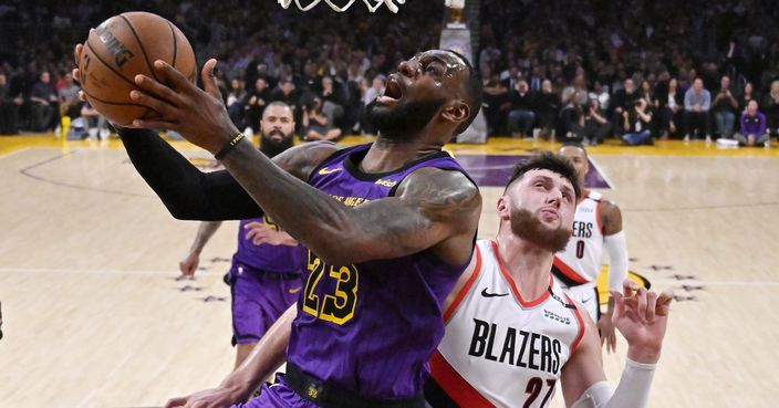 Los Angeles Lakers forward LeBron James shoots as Portland Trail Blazers center Jusuf Nurkic defends during the second half of an NBA basketball game Wednesday, Nov. 14, 2018, in Los Angeles. The Lakers won 126-117. (AP Photo/Mark J. Terrill)