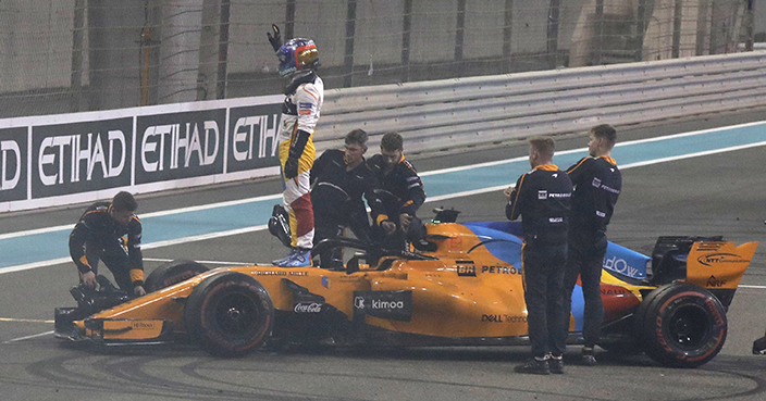 Mclaren driver Fernando Alonso of Spain waves to spectators after the Emirates Formula One Grand Prix at the Yas Marina racetrack in Abu Dhabi, United Arab Emirates, Sunday, Nov. 25, 2018.(AP Photo/Luca Bruno)