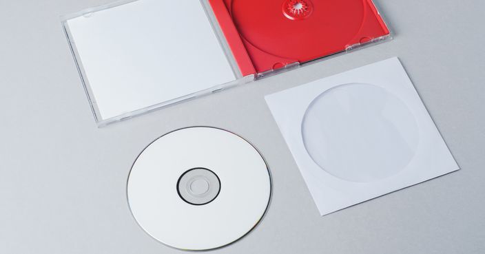 Blank CD on gray background. Mockup for branding