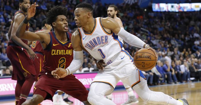 Oklahoma City Thunder guard Russell Westbrook (0) drives to the basket around Cleveland Cavaliers guard Collin Sexton (2) during the second half of an NBA basketball game in Oklahoma City, Wednesday, Nov. 28, 2018. Oklahoma City won 100-83. (AP Photo/Alonzo Adams)