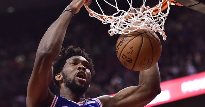Philadelphia 76ers center Joel Embiid (21) dunks against the Toronto Raptors during second half NBA basketball action in Toronto on Wednesday, Dec. 5, 2018. (Frank Gunn/The Canadian Press via AP)