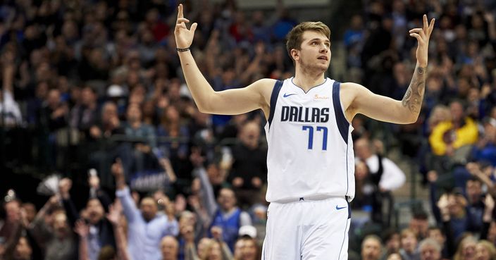 Dallas Mavericks forward Luka Doncic (77) reacts after making a 3-pointer against the Houston Rockets during the second half of an NBA basketball game, Saturday, Dec. 8, 2018, in Dallas. (AP Photo/Cooper Neill)