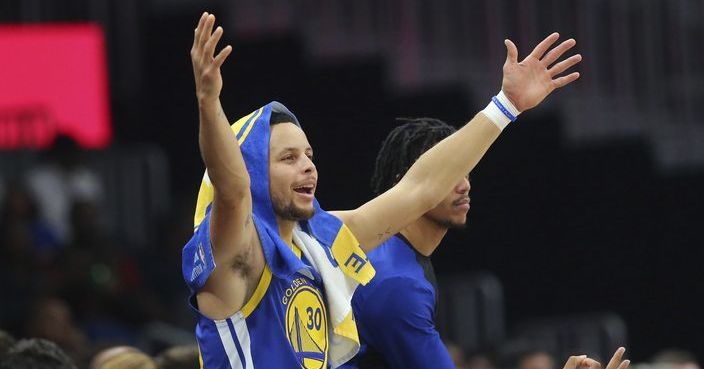 Golden State Warriors guard Stephen Curry (30) reacts from the sideline during the first half of an NBA basketball game Monday, Dec. 3, 2018, in Atlanta. Golden State won 128-111. (AP Photo/John Bazemore)