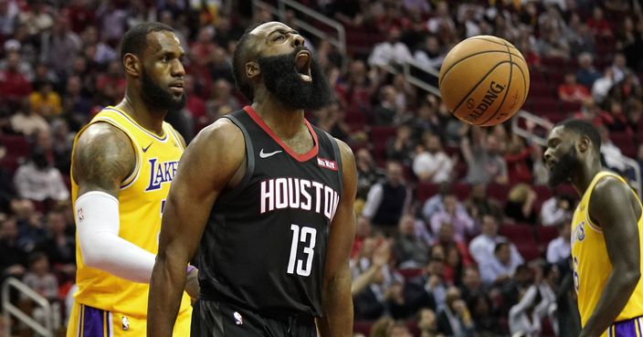 Houston Rockets' James Harden (13) screams after making a basket as Los Angeles Lakers' LeBron James, left, and Lance Stephenson, right, watch during the second half of an NBA basketball game Thursday, Dec. 13, 2018, in Houston. The Rockets won 126-111. (AP Photo/David J. Phillip)