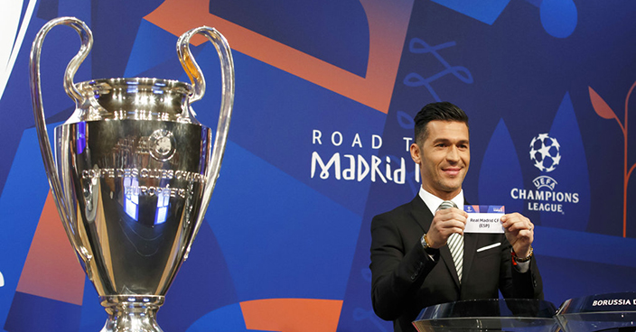 Former Spain's soccer player Luis Garcia, ambassador for the UEFA Champions League, shows a ticket of Spain's club Real Madrid CF, during the drawing of the matches for the Champions League 2018/19 Round of 16, at the UEFA headquarters in Nyon, Switzerland, Monday, Dec. 17, 2018. (Salvatore Di Nolfi/Keystone via AP)