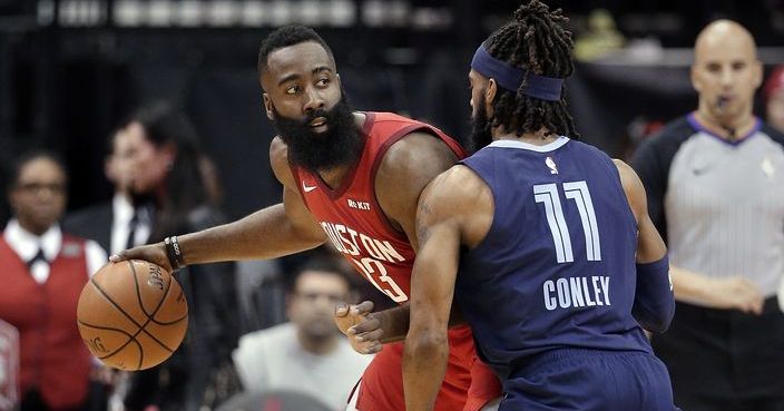 Houston Rockets guard James Harden (13) looks to pass the ball under pressure from Memphis Grizzlies guard Mike Conley (11) during the first half of an NBA basketball game Monday, Dec. 31, 2018, in Houston. (AP Photo/Michael Wyke)