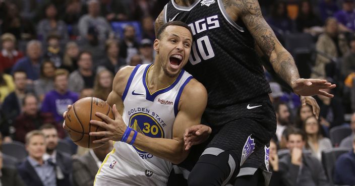 Golden State Warriors guard Stephen Curry, left, drives against Sacramento Kings center Willie Cauley-Stein during the first quarter of an NBA basketball game, Saturday, Jan. 5, 2019, in Sacramento, Calif. (AP Photo/Rich Pedroncelli)