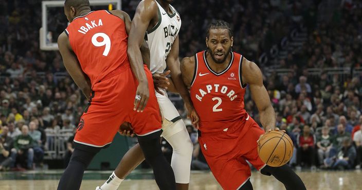 Toronto Raptors' Kawhi Leonard (2) drives to the basket against Milwaukee Bucks' Khris Middleton during the first half of an NBA basketball game, Saturday, Jan. 5, 2019, in Milwaukee. (AP Photo/Aaron Gash)