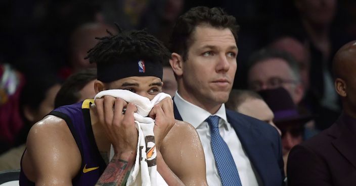 Los Angeles Lakers center JaVale McGee, left, sits on the bench next to coach Luke Walton during the closing seconds of the team's NBA basketball game against the New York Knicks on Friday, Jan. 4, 2019, in Los Angeles. The Knicks won 119-112. (AP Photo/Mark J. Terrill)