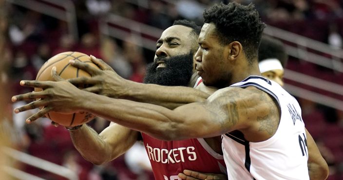 Houston Rockets' James Harden (13) is fouled by Brooklyn Nets' Treveon Graham during the first half of an NBA basketball game Wednesday, Jan. 16, 2019, in Houston. (AP Photo/David J. Phillip)