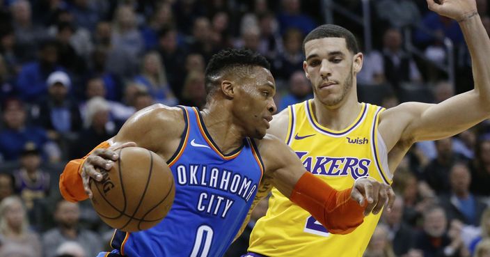 Oklahoma City Thunder guard Russell Westbrook (0) drives past Los Angeles Lakers guard Lonzo Ball during the first half of an NBA basketball game in Oklahoma City, Thursday, Jan. 17, 2019. (AP Photo/Sue Ogrocki)