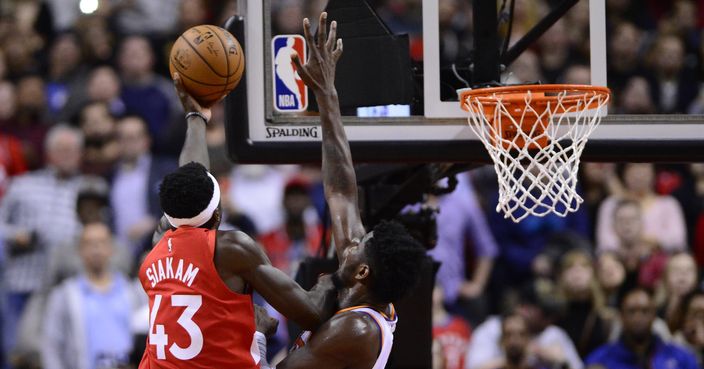 Toronto Raptors forward Pascal Siakam (43) scores the game-winning basket over Phoenix Suns center Deandre Ayton (22) during an NBA basketball game Thursday, Jan. 17, 2019, in Toronto. (Frank Gunn/The Canadian Press via AP)