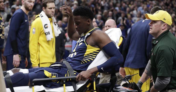 Indiana Pacers guard Victor Oladipo is taken off the court on a stretcher after he was injured during the first half of the team's NBA basketball game against the Toronto Raptors in Indianapolis, Wednesday, Jan. 23, 2019. (AP Photo/Michael Conroy)