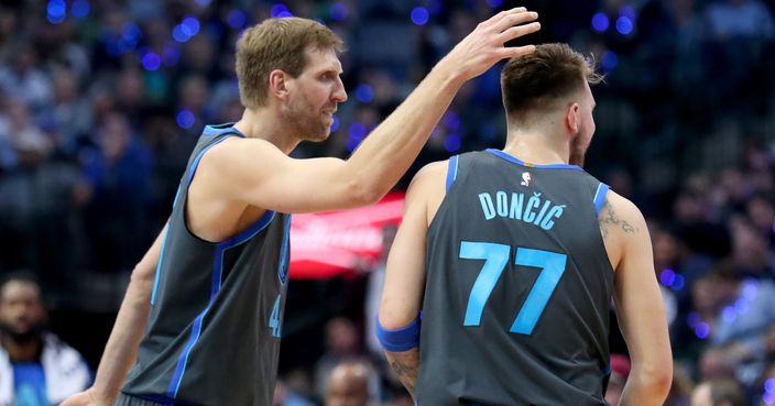 DALLAS, TEXAS - JANUARY 16: Dirk Nowitzki #41 of the Dallas Mavericks celebrates with Luka Doncic #77 of the Dallas Mavericks in the first half at American Airlines Center on January 16, 2019 in Dallas, Texas. NOTE TO USER: User expressly acknowledges and agrees that, by downloading and or using this photograph, User is consenting to the terms and conditions of the Getty Images License Agreement. (Photo by Tom Pennington/Getty Images)