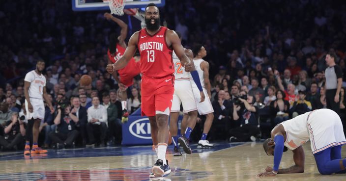 Houston Rockets' James Harden (13) reacts after teammate Kenneth Faried (35) dunked the ball during the second half of the team's NBA basketball game against the New York Knicks on Wednesday, Jan. 23, 2019, in New York. Harden scored 61 points as the Rockets won 114-110. (AP Photo/Frank Franklin II)