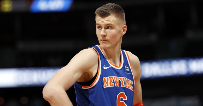 FILE - In this Jan. 25, 2018, file photo, New York Knicks forward Kristaps Porzingis, of Latvia, reacts after fouling out during the second half of the team's NBA basketball game against the Denver Nuggets on Thursday,, in Denver. The Knicks agree to trade injured star Kristaps Porzingis to Dallas Mavericks on Thursday, Jan. 31, 2019. (AP Photo/David Zalubowski, File)