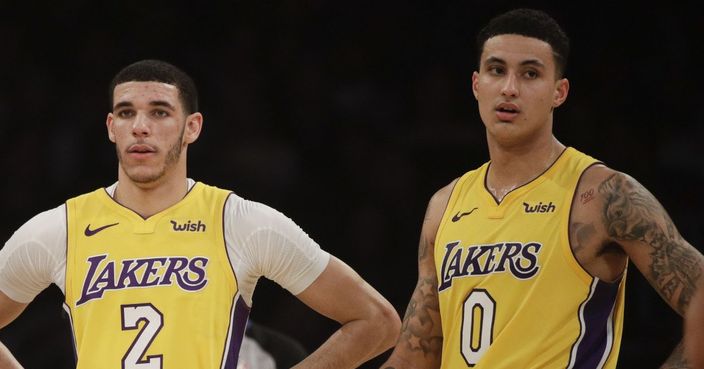 Los Angeles Lakers' Jordan Clarkson, from left, Lonzo Ball and Kyle Kuzma stand on the court during the first half of an NBA basketball game against the San Antonio Spurs Thursday, Jan. 11, 2018, in Los Angeles. (AP Photo/Jae C. Hong) ORG XMIT: NYOTK