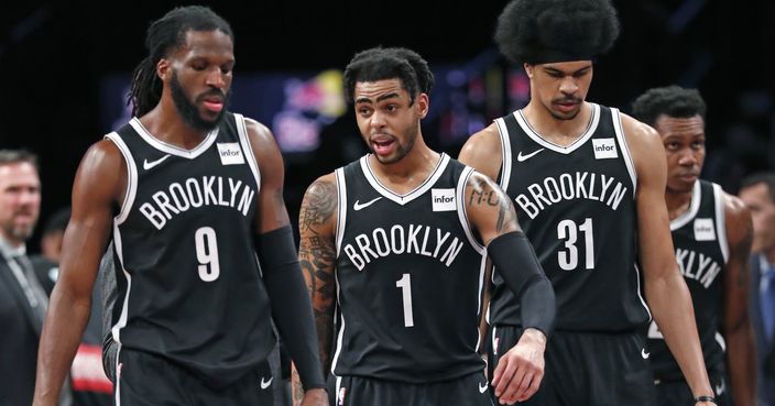 Brooklyn Nets forward DeMarre Carroll, guard D'Angelo Russell and center Jarrett Allen, from left, walk back on court together after a timeout during the second half of the team's NBA basketball game against the Chicago Bulls, Tuesday, Jan. 29, 2019, in New York. The Nets defeated the Bulls 122-117. (AP Photo/Kathy Willens)