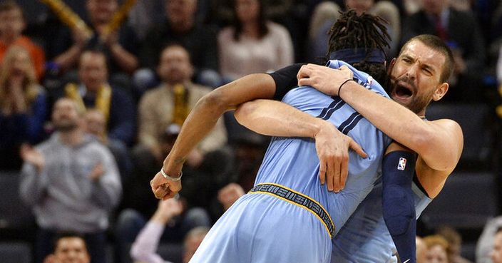 Memphis Grizzlies center Marc Gasol, right, lifts guard Mike Conley as they celebrate in the second half of an NBA basketball game against the Indiana Pacers Saturday, Jan. 26, 2019, in Memphis, Tenn. (AP Photo/Brandon Dill)