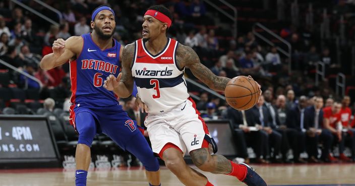 Washington Wizards guard Bradley Beal (3) drives on Detroit Pistons guard Bruce Brown (6) during the second half of an NBA basketball game, Monday, Feb. 11, 2019, in Detroit. (AP Photo/Carlos Osorio)