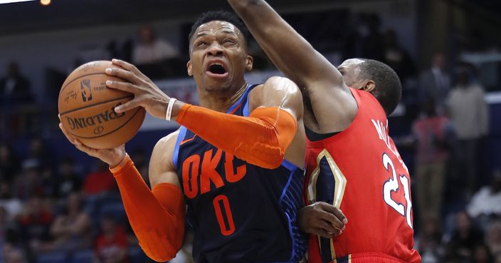 Oklahoma City Thunder guard Russell Westbrook (0) drives to the basket past New Orleans Pelicans forward Darius Miller (21) during the first half of an NBA basketball game in New Orleans, Thursday, Feb. 14, 2019. (AP Photo/Tyler Kaufman)